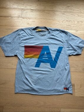 Aviator Nation Light Blue Tee with Rainbow Stripe AV Logo
